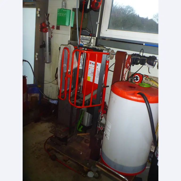 Passenger cars, electric cars, and automotive repair shop equipment at a Fiat dealership-1