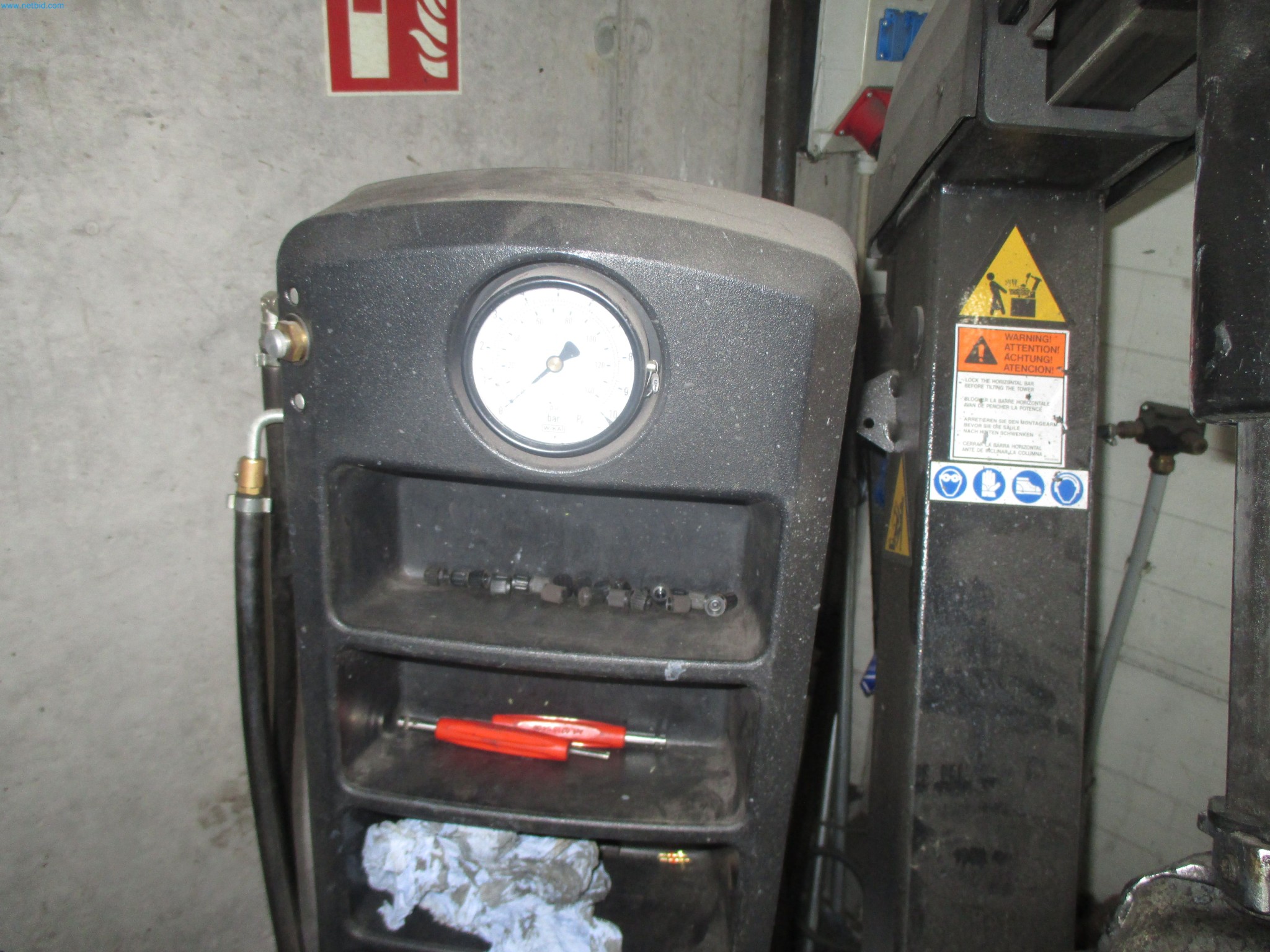 Passenger cars, electric cars, and automotive repair shop equipment at a Fiat dealership-3