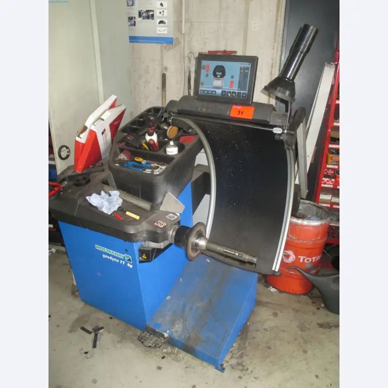 Passenger cars, electric cars, and automotive repair shop equipment at a Fiat dealership-1