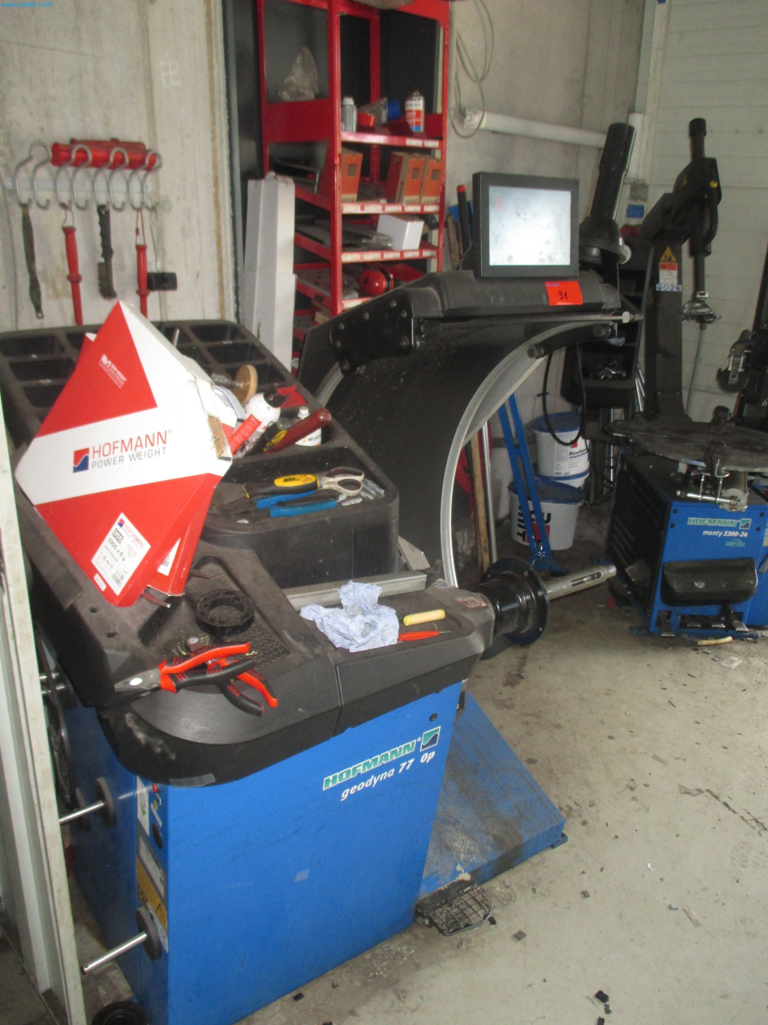 Passenger cars, electric cars, and automotive repair shop equipment at a Fiat dealership-2