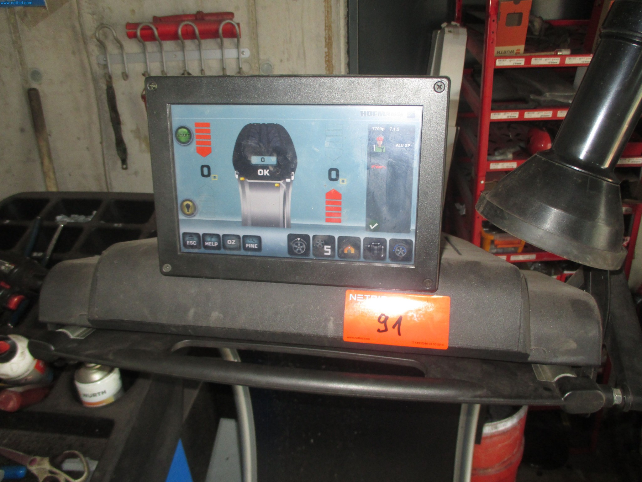 Passenger cars, electric cars, and automotive repair shop equipment at a Fiat dealership-3