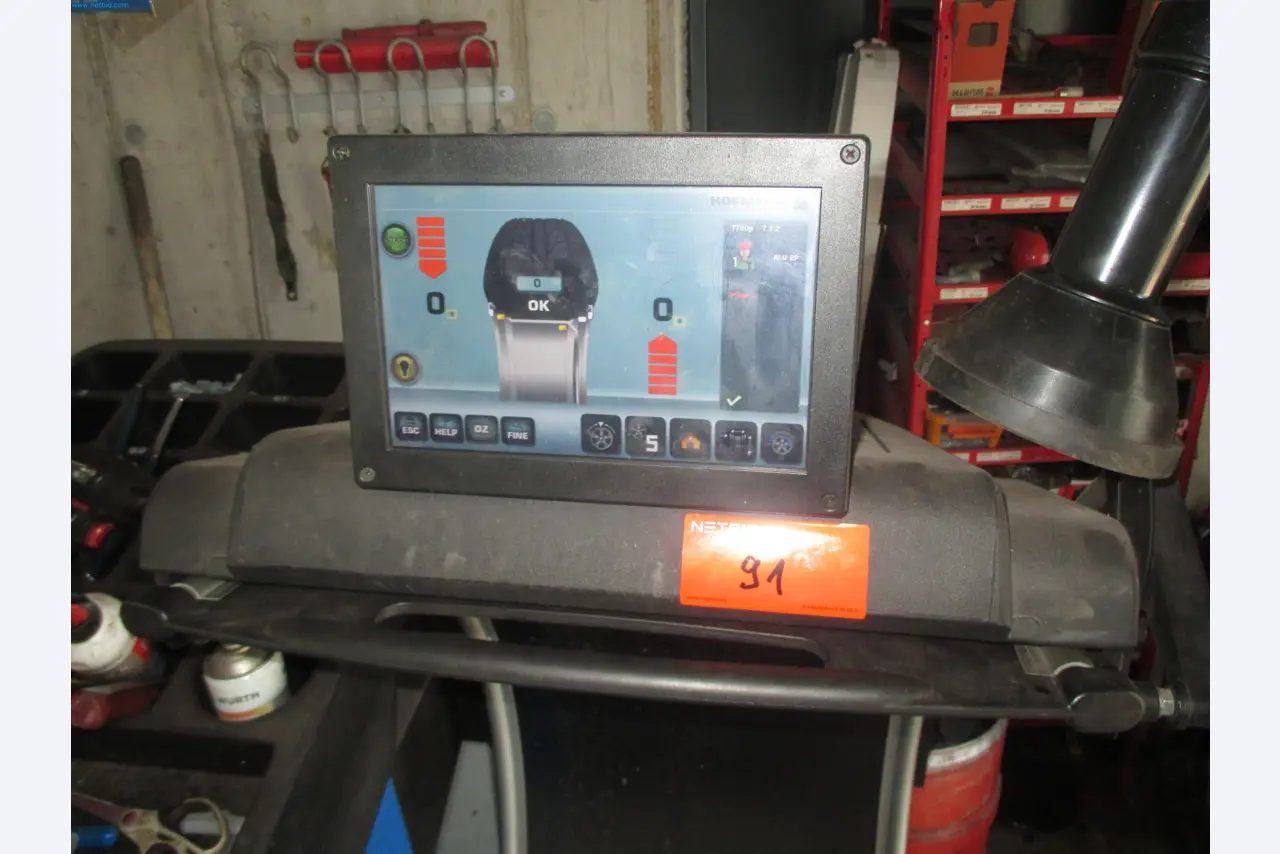 Passenger cars, electric cars, and automotive repair shop equipment at a Fiat dealership-3