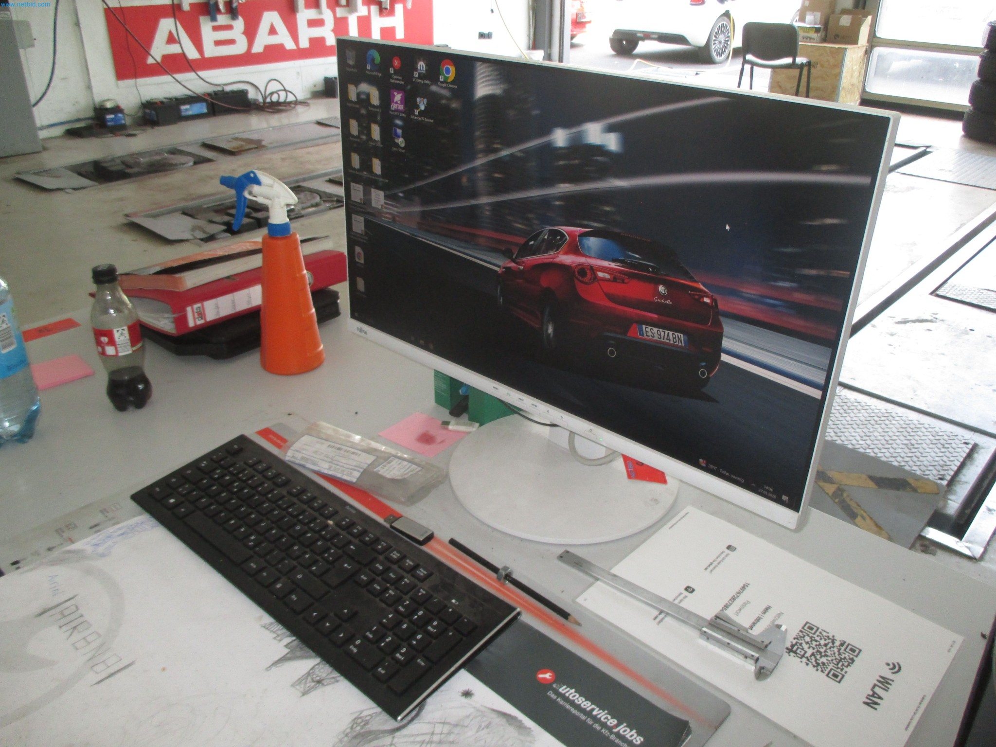 Passenger cars, electric cars, and automotive repair shop equipment at a Fiat dealership-1