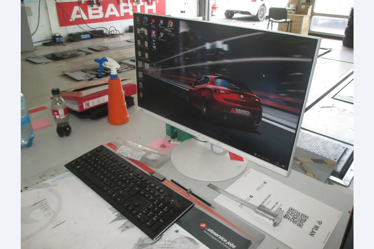 Passenger cars, electric cars, and automotive repair shop equipment at a Fiat dealership-1