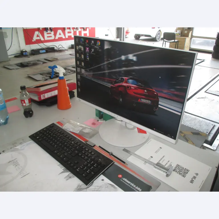 Passenger cars, electric cars, and automotive repair shop equipment at a Fiat dealership-1