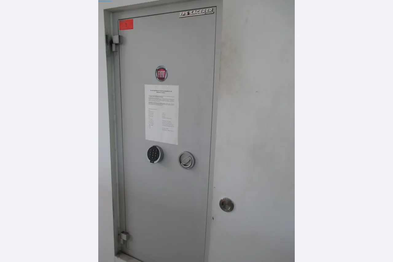 Passenger cars, electric cars, and automotive repair shop equipment at a Fiat dealership-2