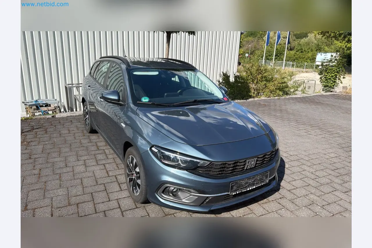 Passenger cars, electric cars, and automotive repair shop equipment at a Fiat dealership-1