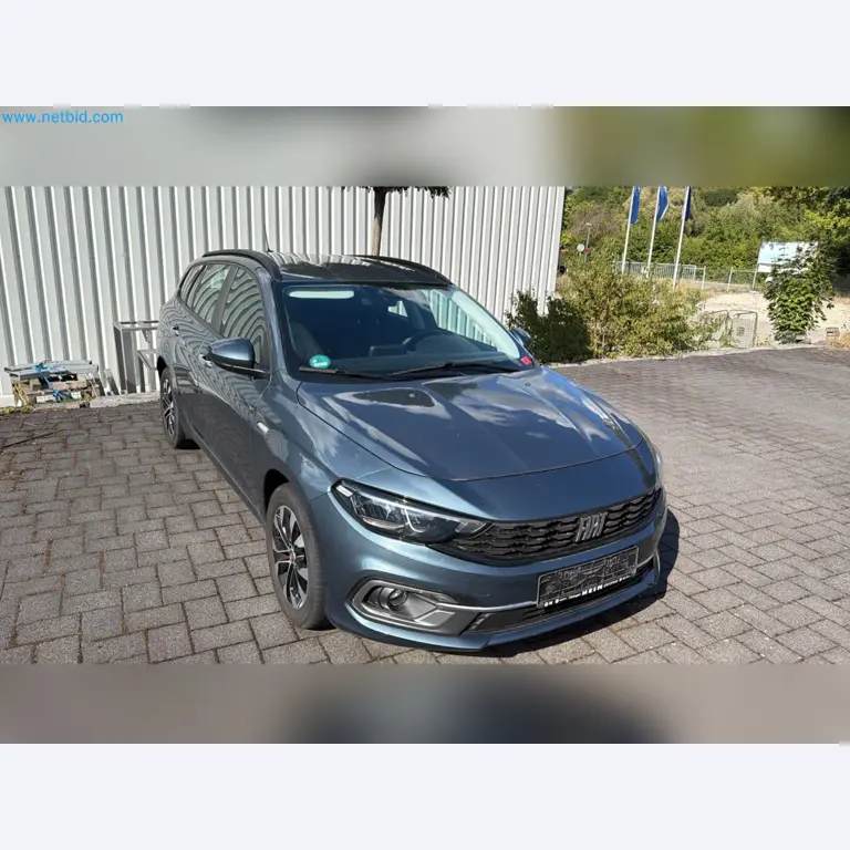 Passenger cars, electric cars, and automotive repair shop equipment at a Fiat dealership-1