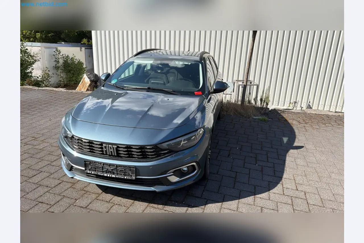 Passenger cars, electric cars, and automotive repair shop equipment at a Fiat dealership-2