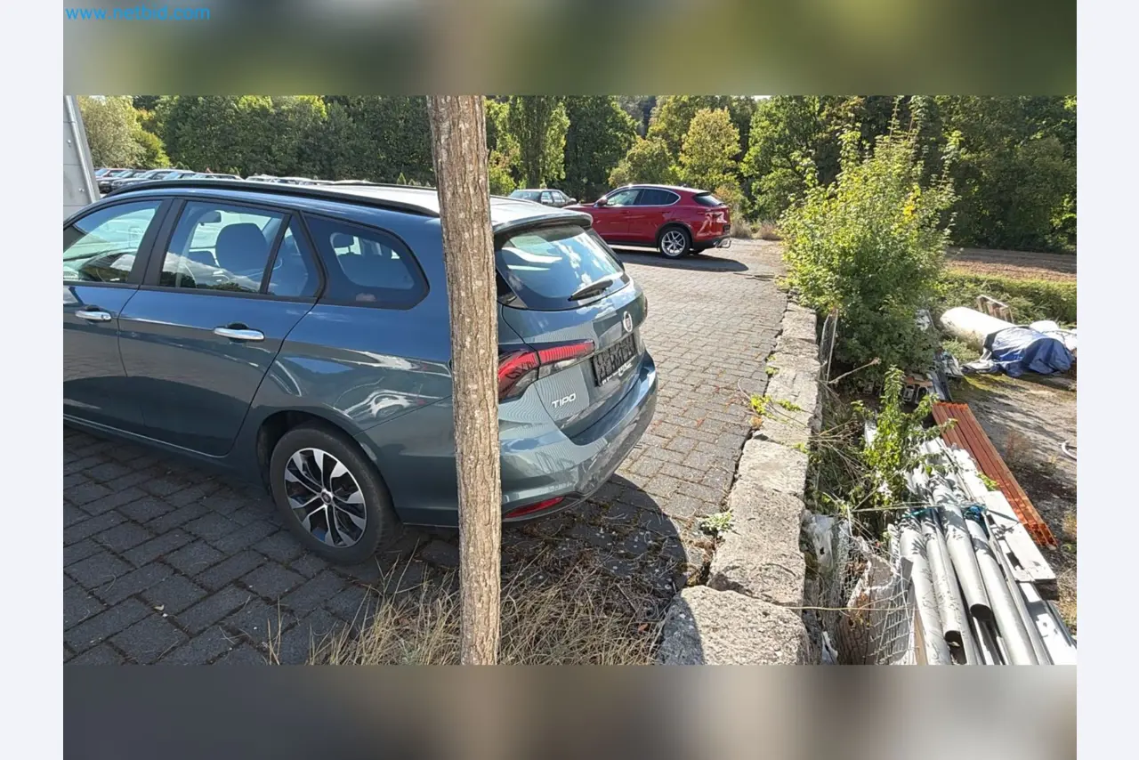Passenger cars, electric cars, and automotive repair shop equipment at a Fiat dealership-6