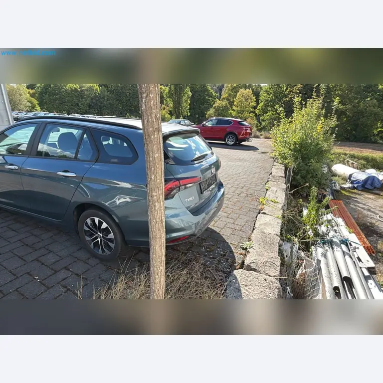 Passenger cars, electric cars, and automotive repair shop equipment at a Fiat dealership-6