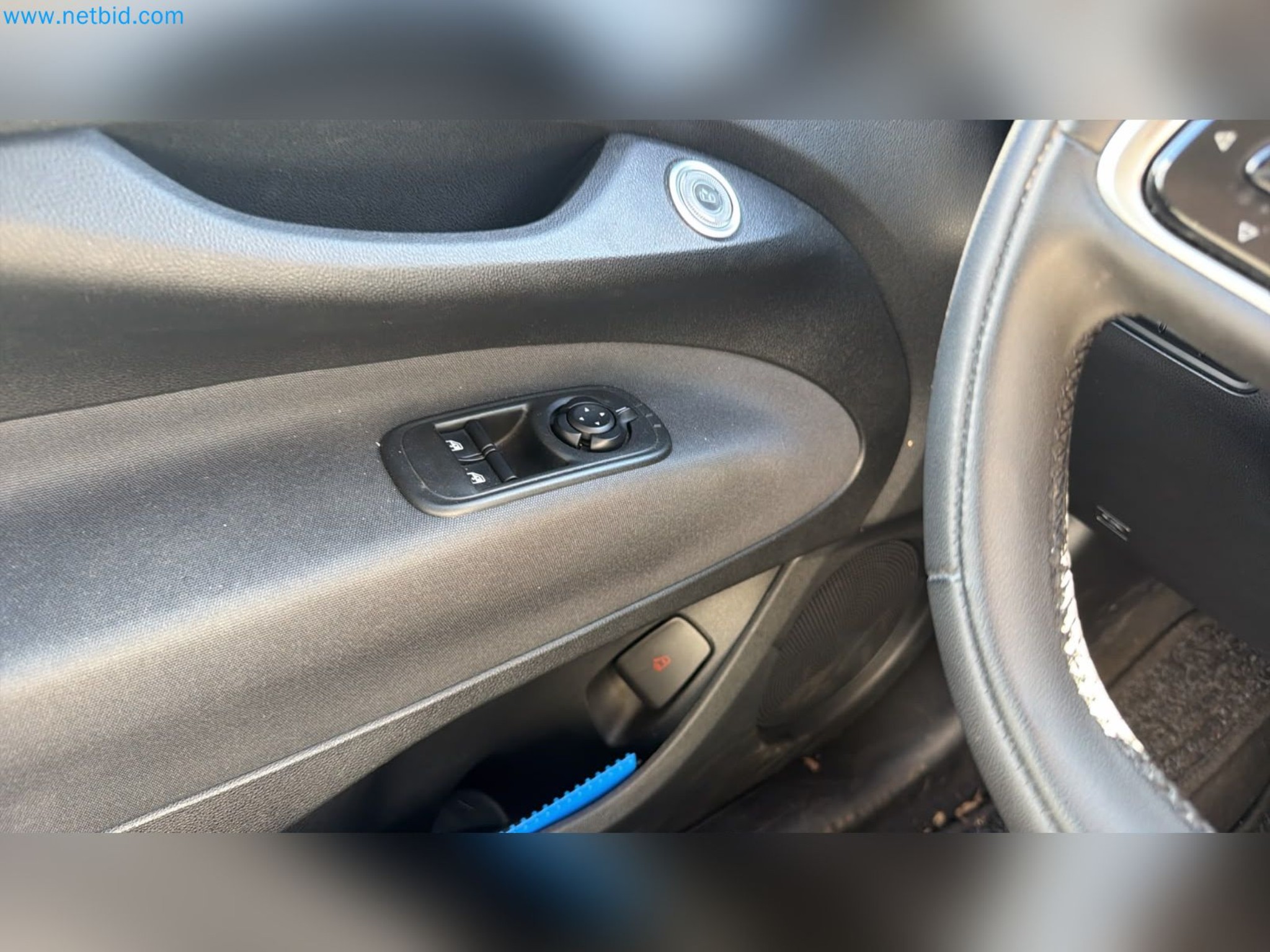 Passenger cars, electric cars, and automotive repair shop equipment at a Fiat dealership-10