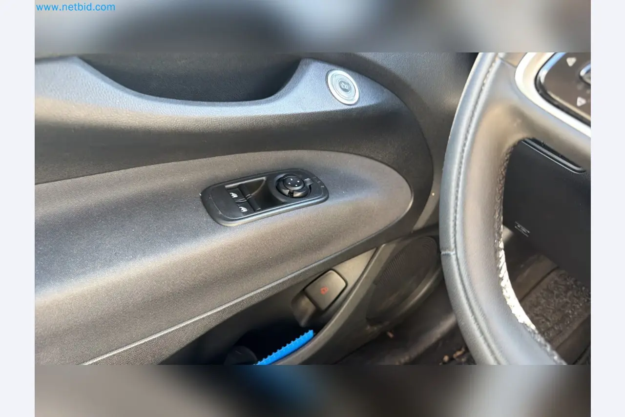 Passenger cars, electric cars, and automotive repair shop equipment at a Fiat dealership-10