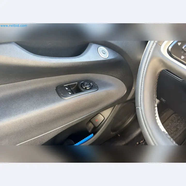 Passenger cars, electric cars, and automotive repair shop equipment at a Fiat dealership-10