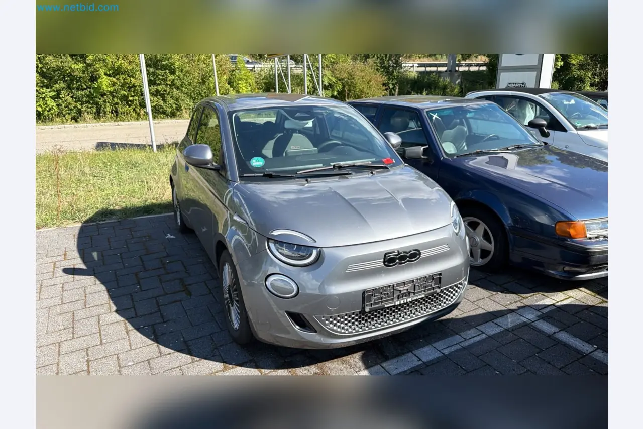 Passenger cars, electric cars, and automotive repair shop equipment at a Fiat dealership-1