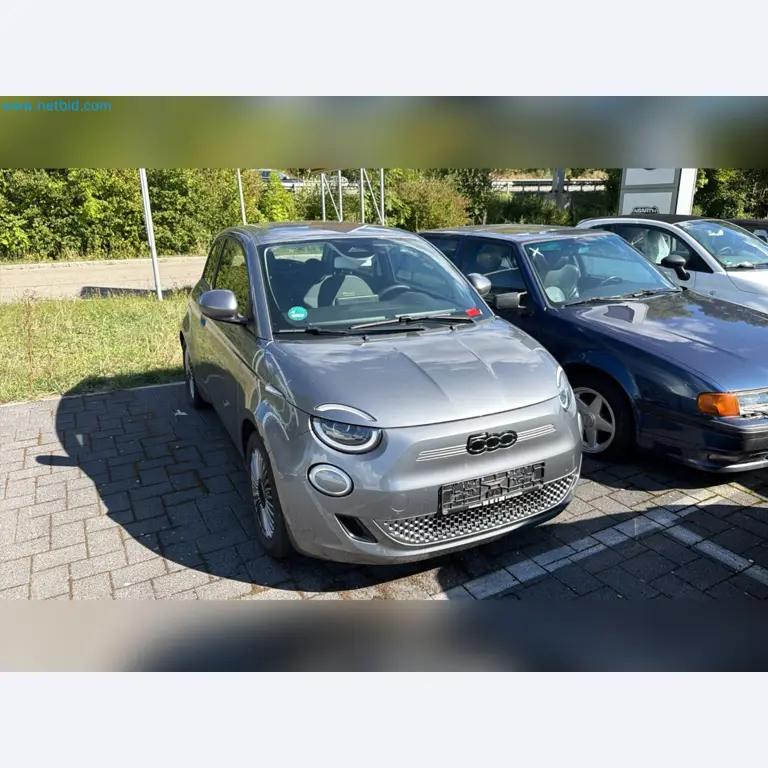 Passenger cars, electric cars, and automotive repair shop equipment at a Fiat dealership-1