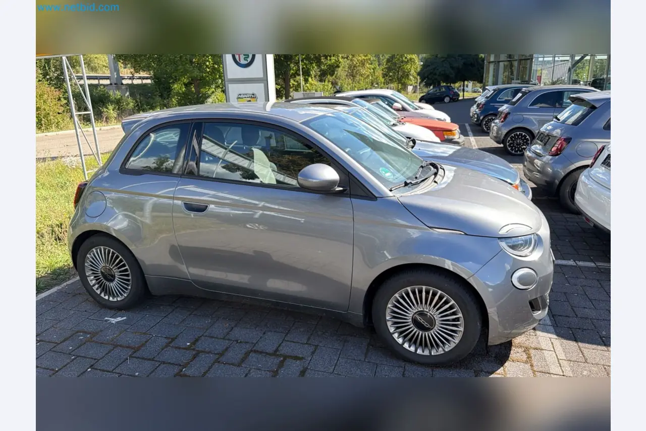 Passenger cars, electric cars, and automotive repair shop equipment at a Fiat dealership-2
