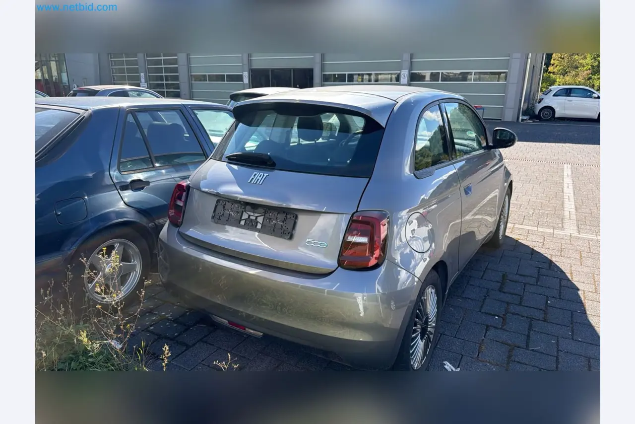Passenger cars, electric cars, and automotive repair shop equipment at a Fiat dealership-3