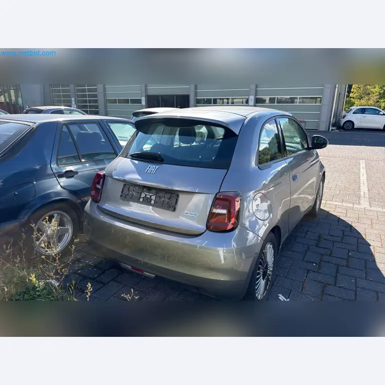 Passenger cars, electric cars, and automotive repair shop equipment at a Fiat dealership-3