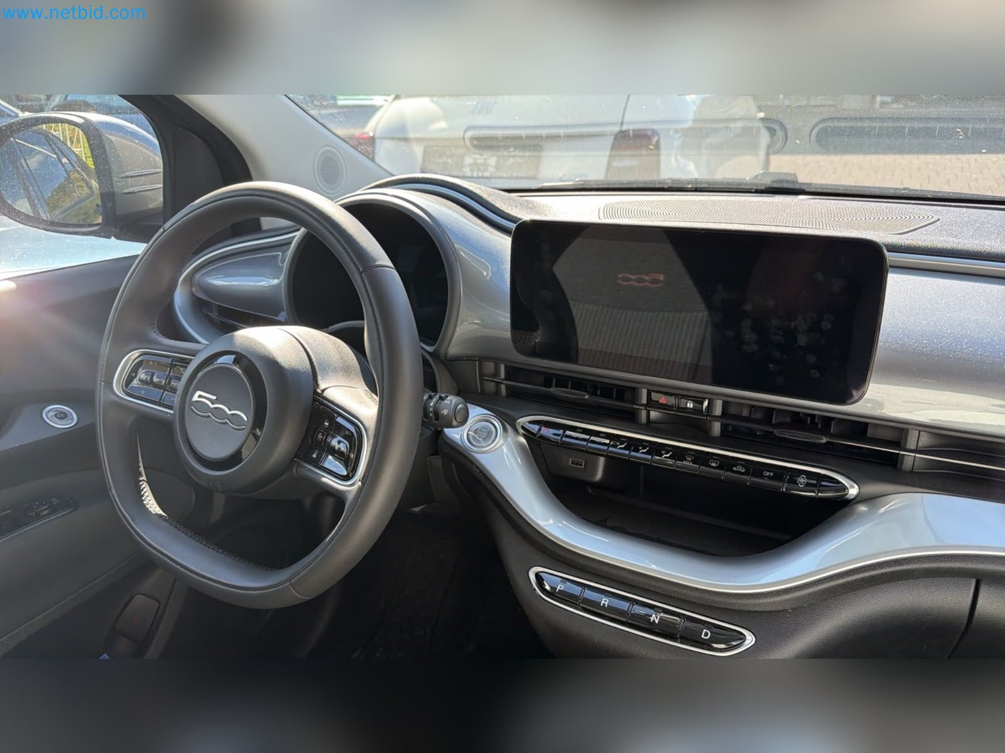 Passenger cars, electric cars, and automotive repair shop equipment at a Fiat dealership-5
