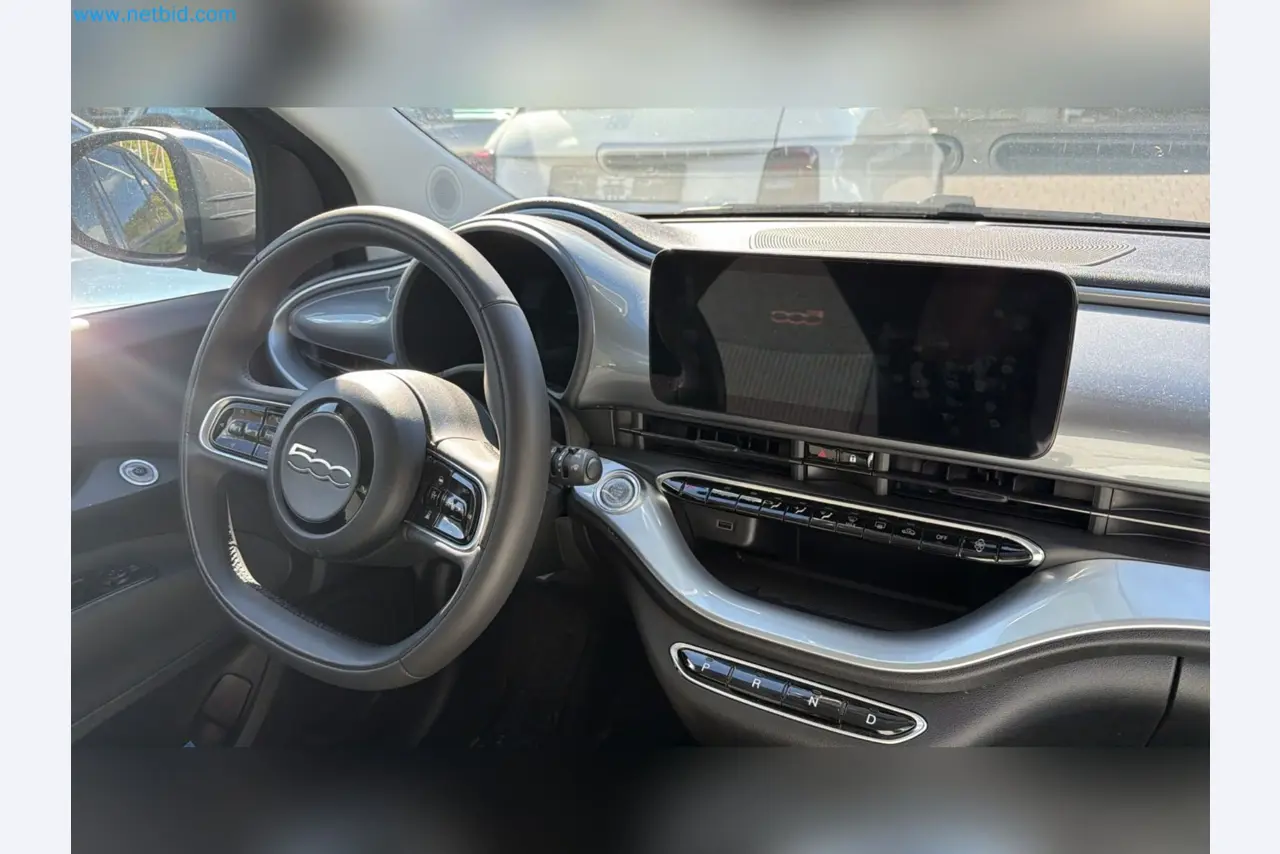 Passenger cars, electric cars, and automotive repair shop equipment at a Fiat dealership-5