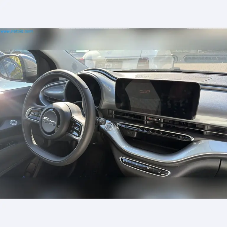 Passenger cars, electric cars, and automotive repair shop equipment at a Fiat dealership-5