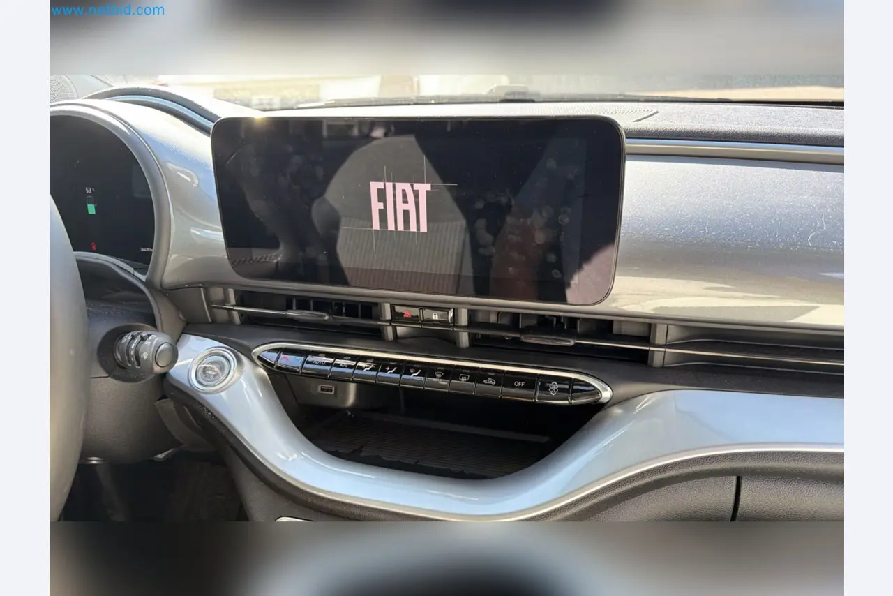 Passenger cars, electric cars, and automotive repair shop equipment at a Fiat dealership-7