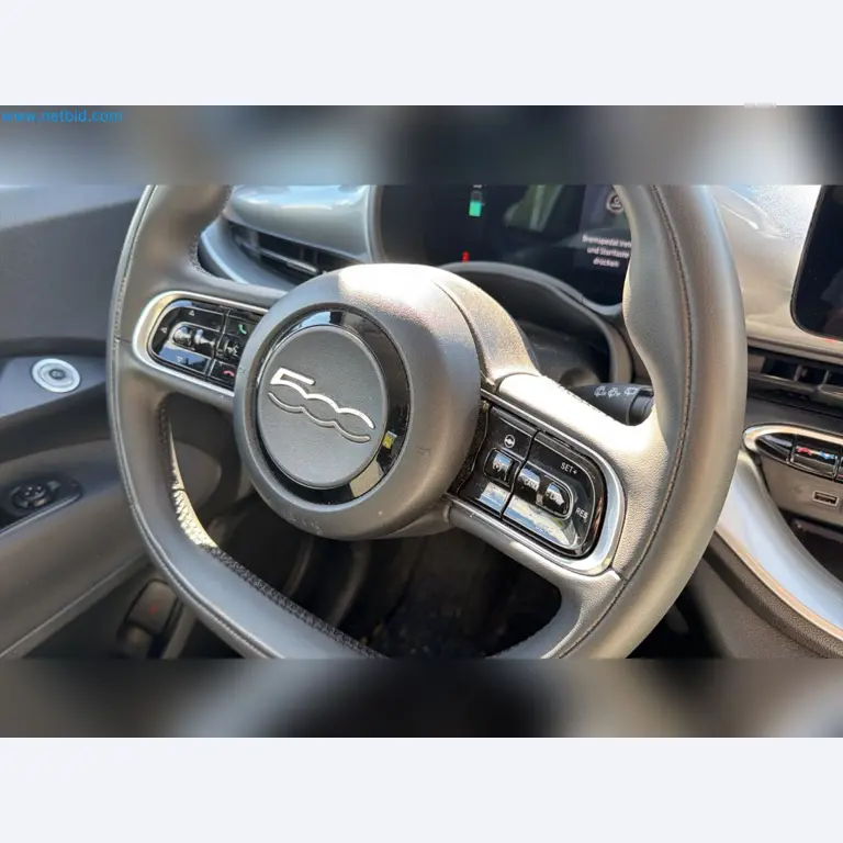 Passenger cars, electric cars, and automotive repair shop equipment at a Fiat dealership-8