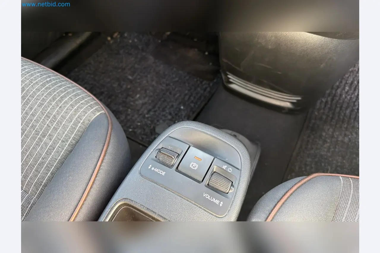 Passenger cars, electric cars, and automotive repair shop equipment at a Fiat dealership-9