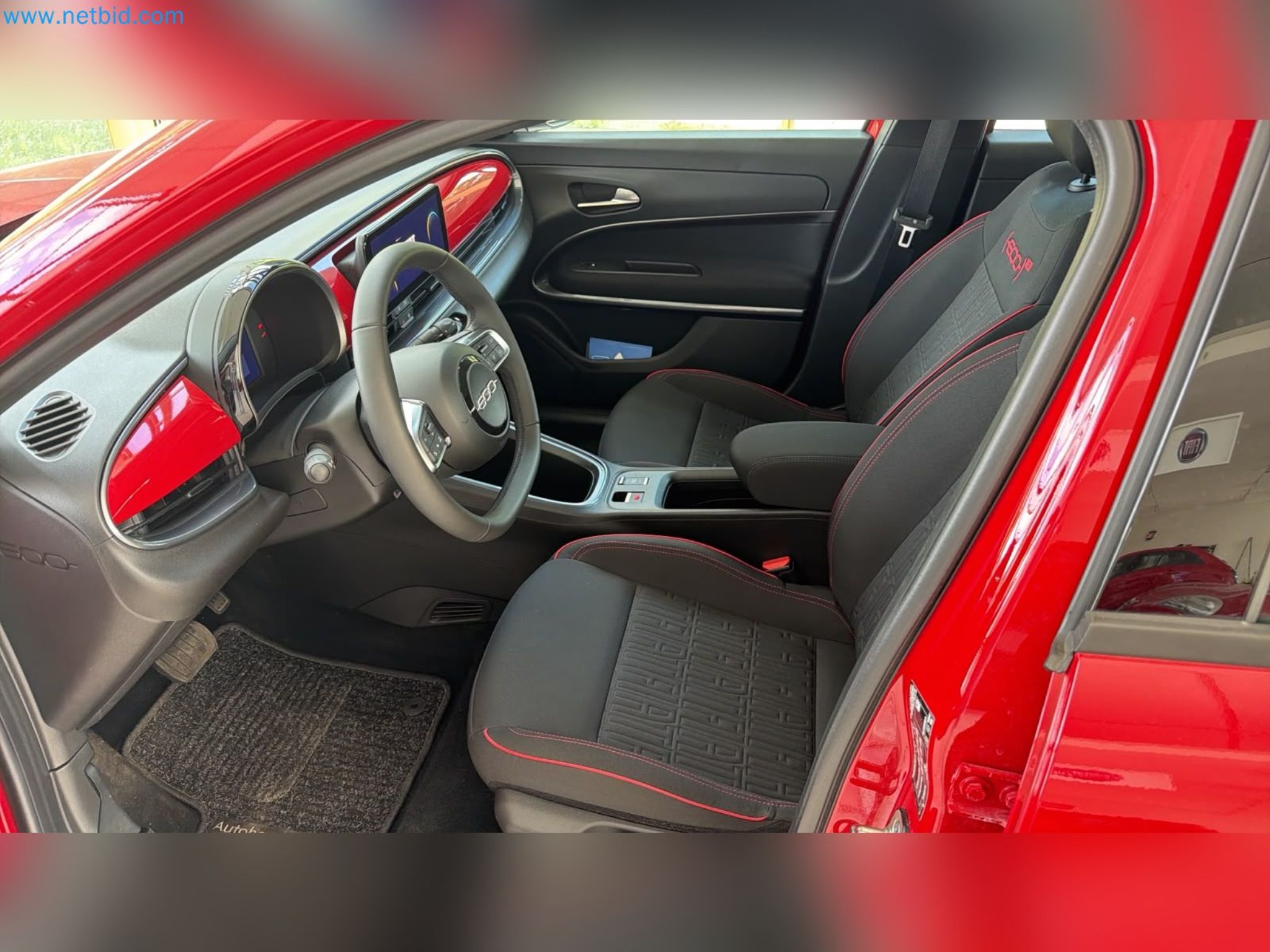 Passenger cars, electric cars, and automotive repair shop equipment at a Fiat dealership-10