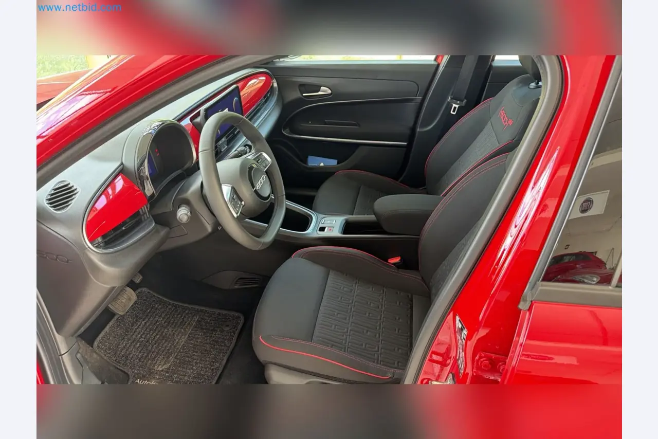 Passenger cars, electric cars, and automotive repair shop equipment at a Fiat dealership-10