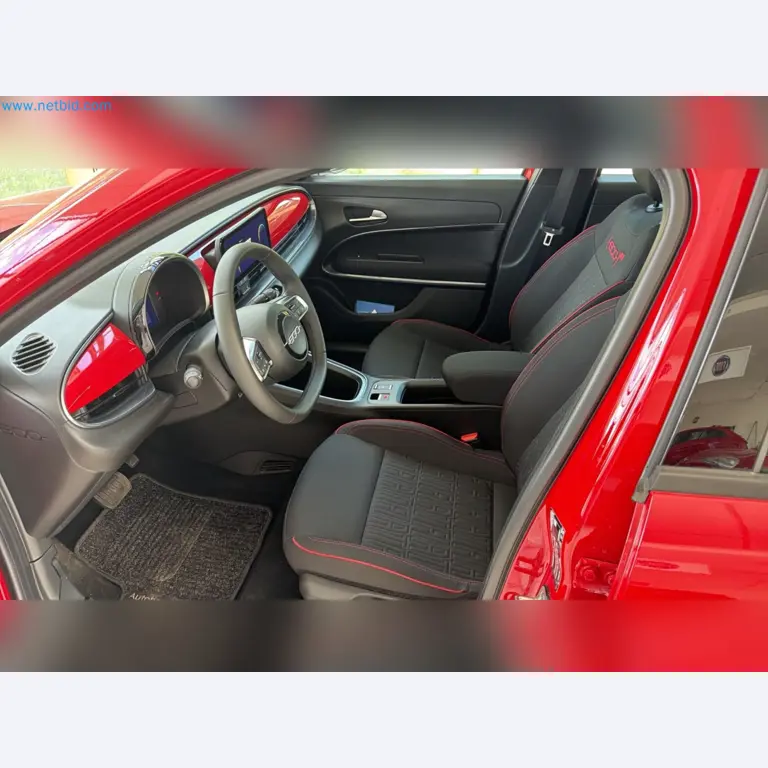 Passenger cars, electric cars, and automotive repair shop equipment at a Fiat dealership-10
