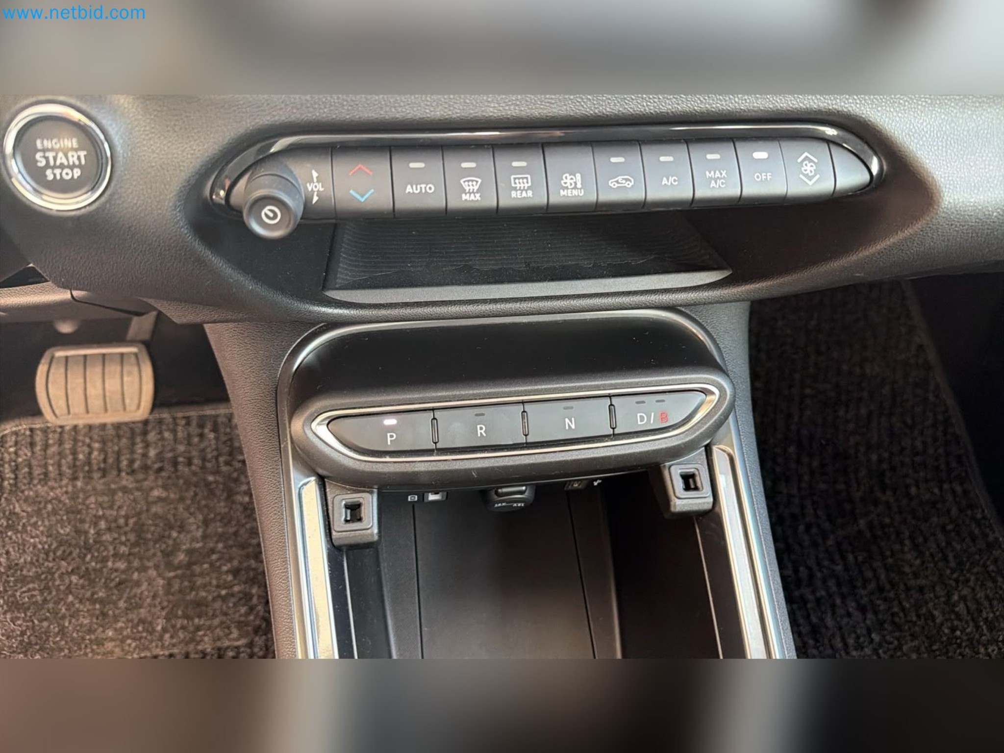 Passenger cars, electric cars, and automotive repair shop equipment at a Fiat dealership-11