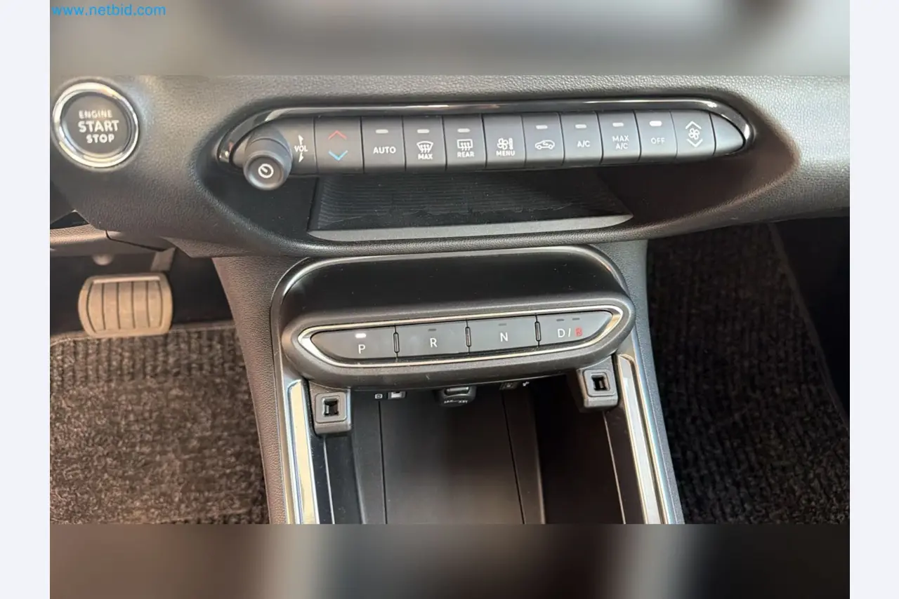 Passenger cars, electric cars, and automotive repair shop equipment at a Fiat dealership-11