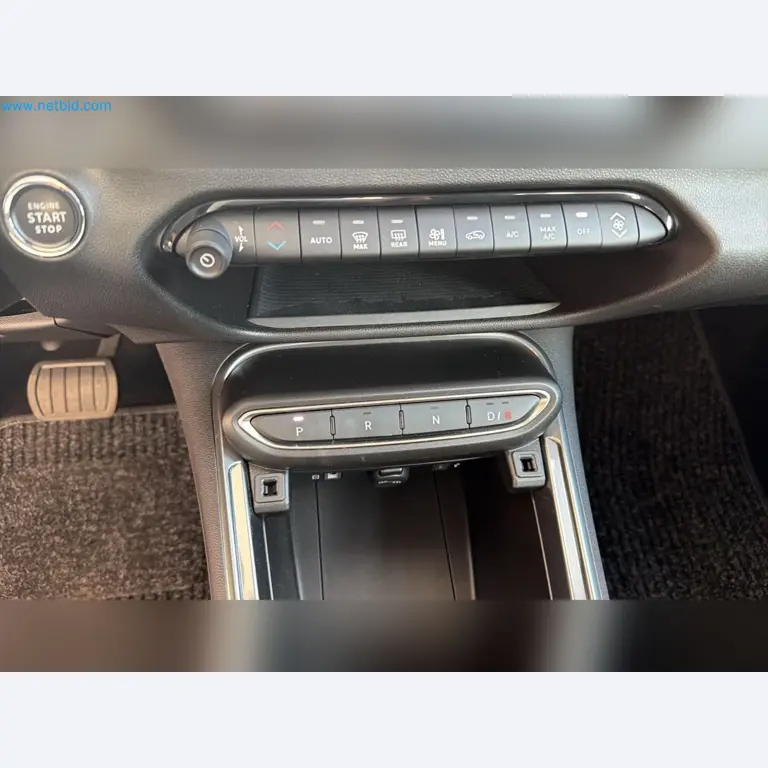 Passenger cars, electric cars, and automotive repair shop equipment at a Fiat dealership-11