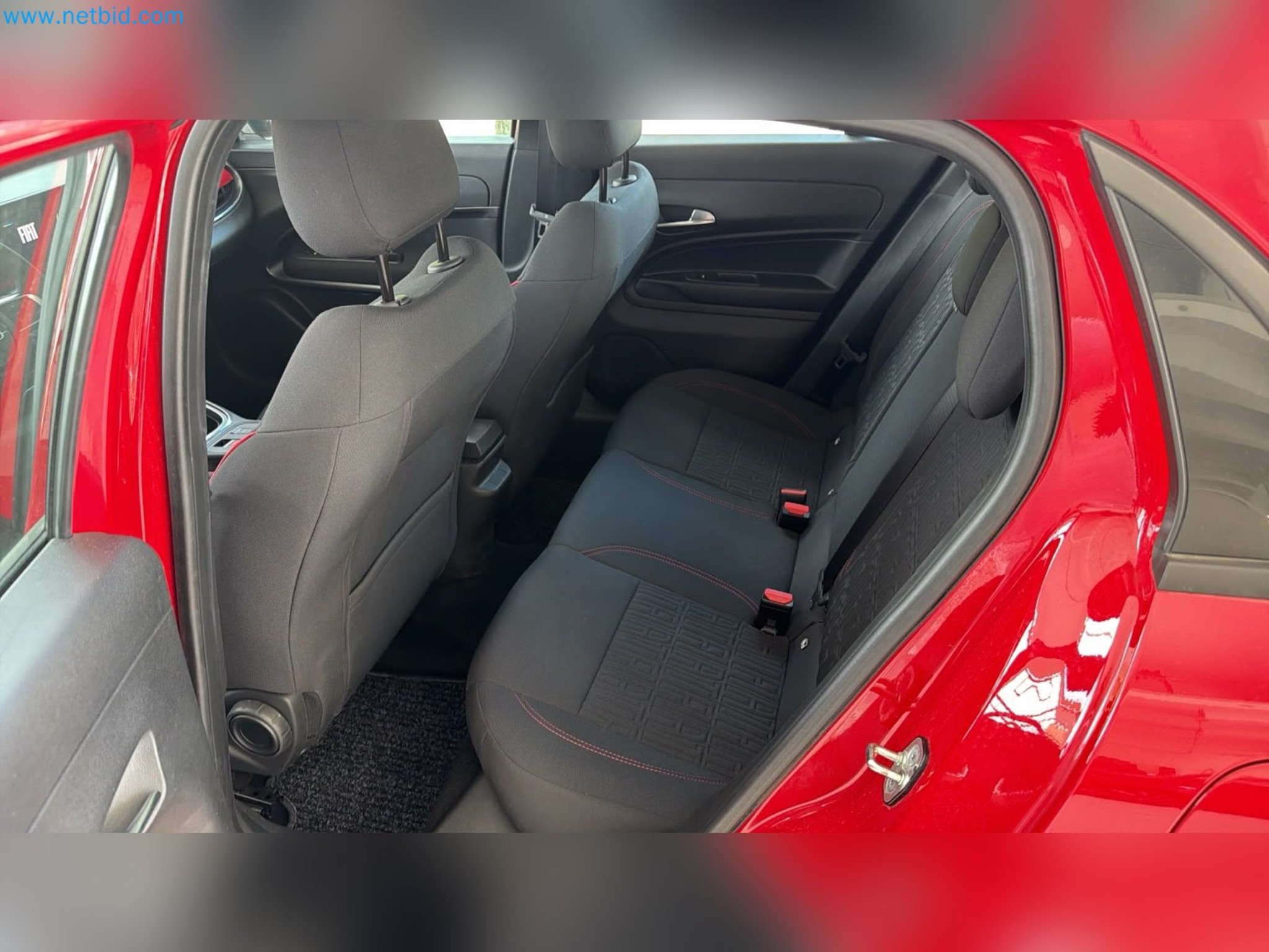 Passenger cars, electric cars, and automotive repair shop equipment at a Fiat dealership-12