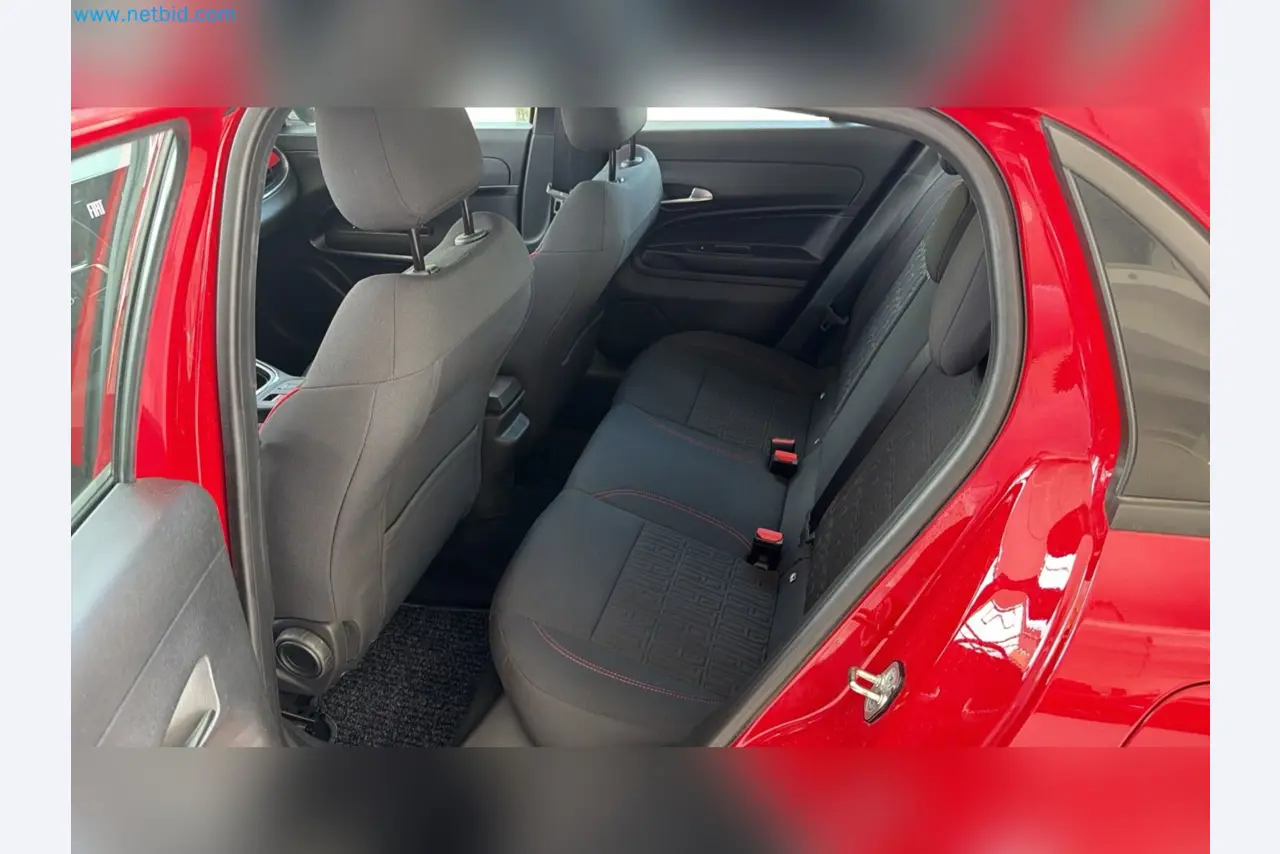 Passenger cars, electric cars, and automotive repair shop equipment at a Fiat dealership-12