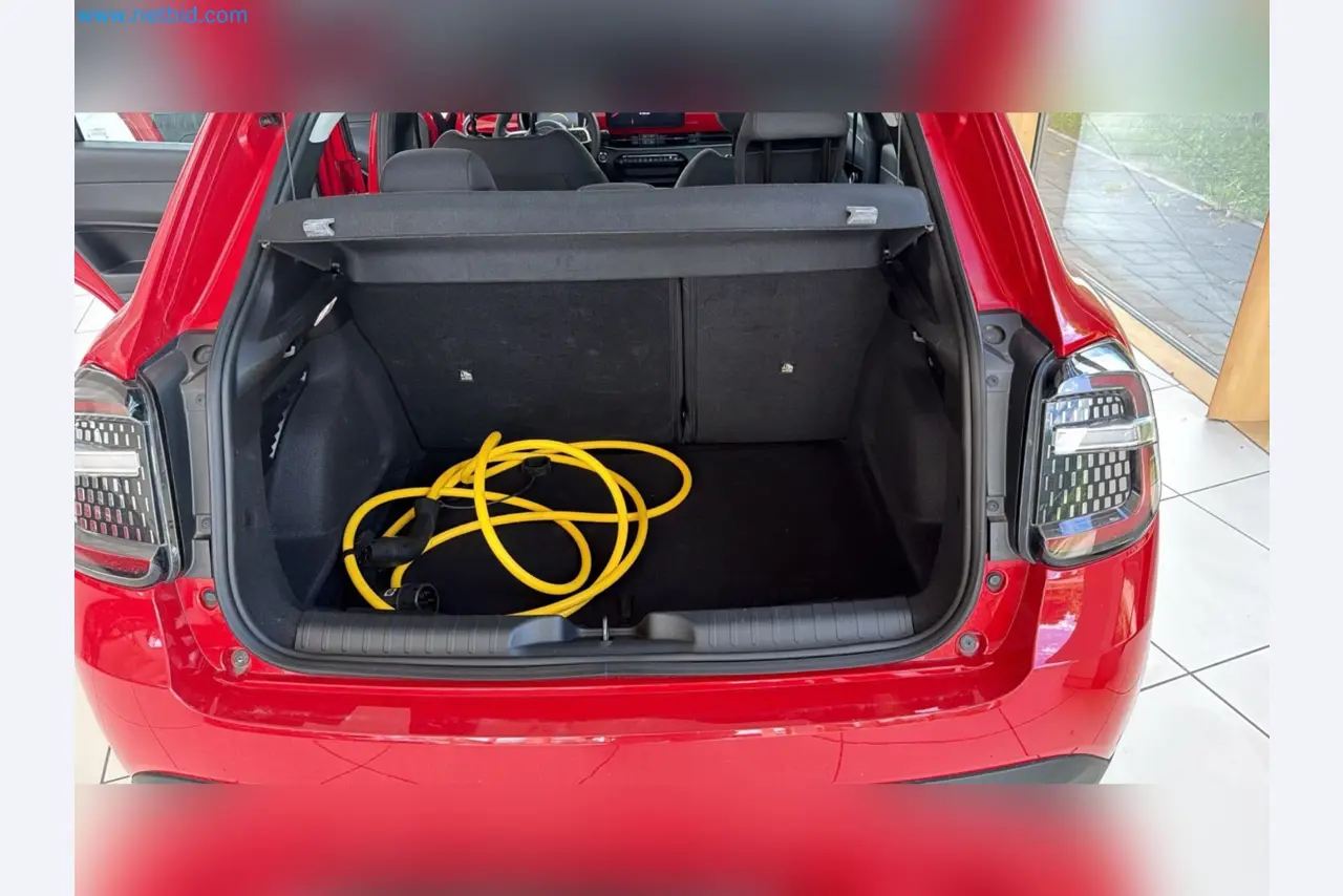 Passenger cars, electric cars, and automotive repair shop equipment at a Fiat dealership-13