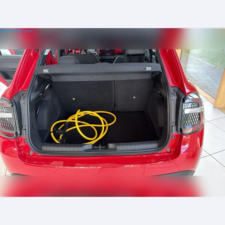Passenger cars, electric cars, and automotive repair shop equipment at a Fiat dealership-13