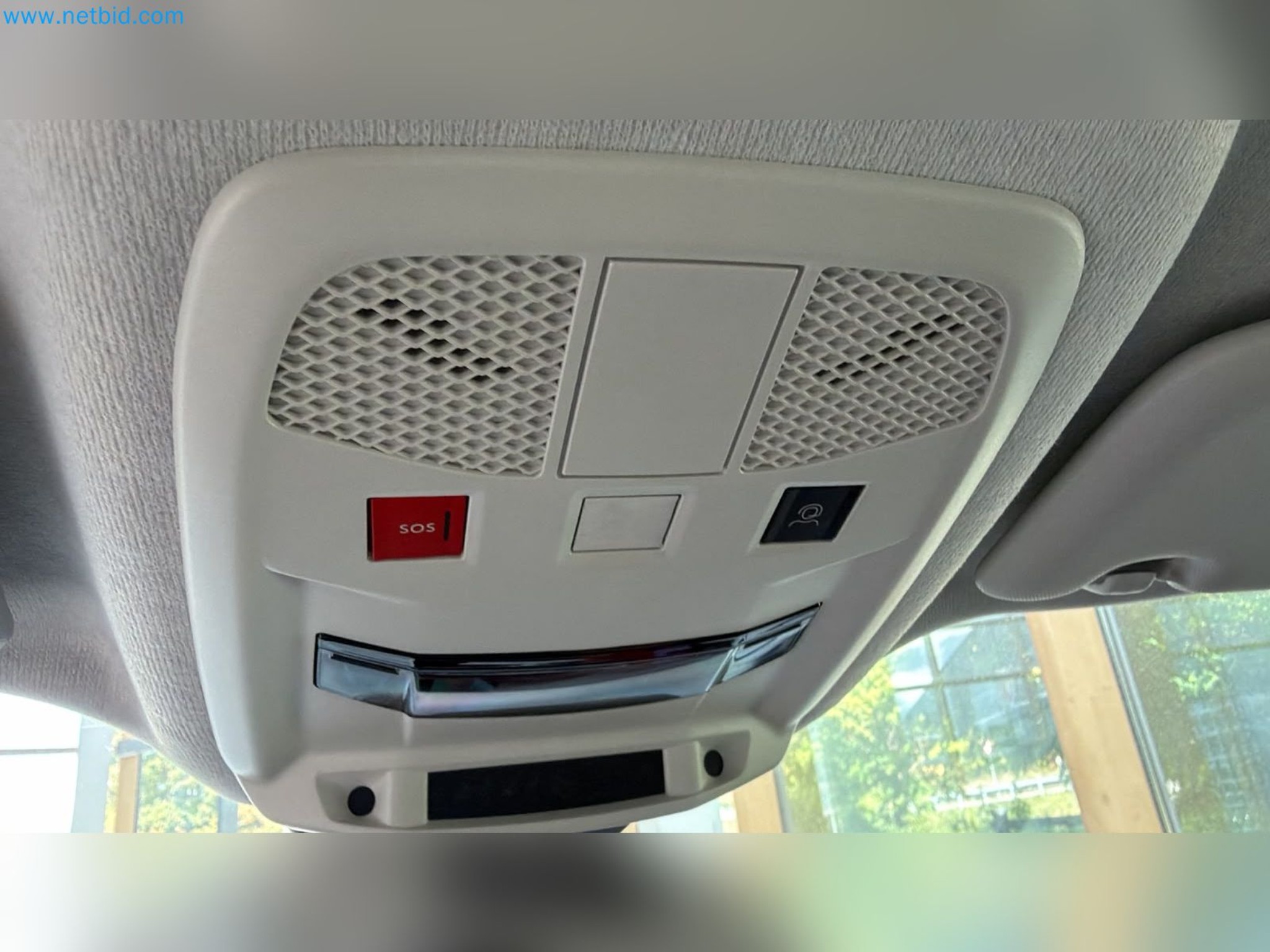 Passenger cars, electric cars, and automotive repair shop equipment at a Fiat dealership-14