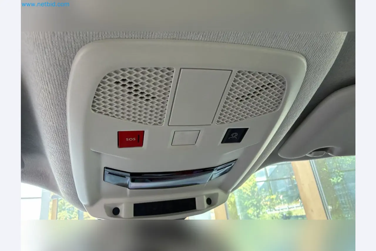 Passenger cars, electric cars, and automotive repair shop equipment at a Fiat dealership-14