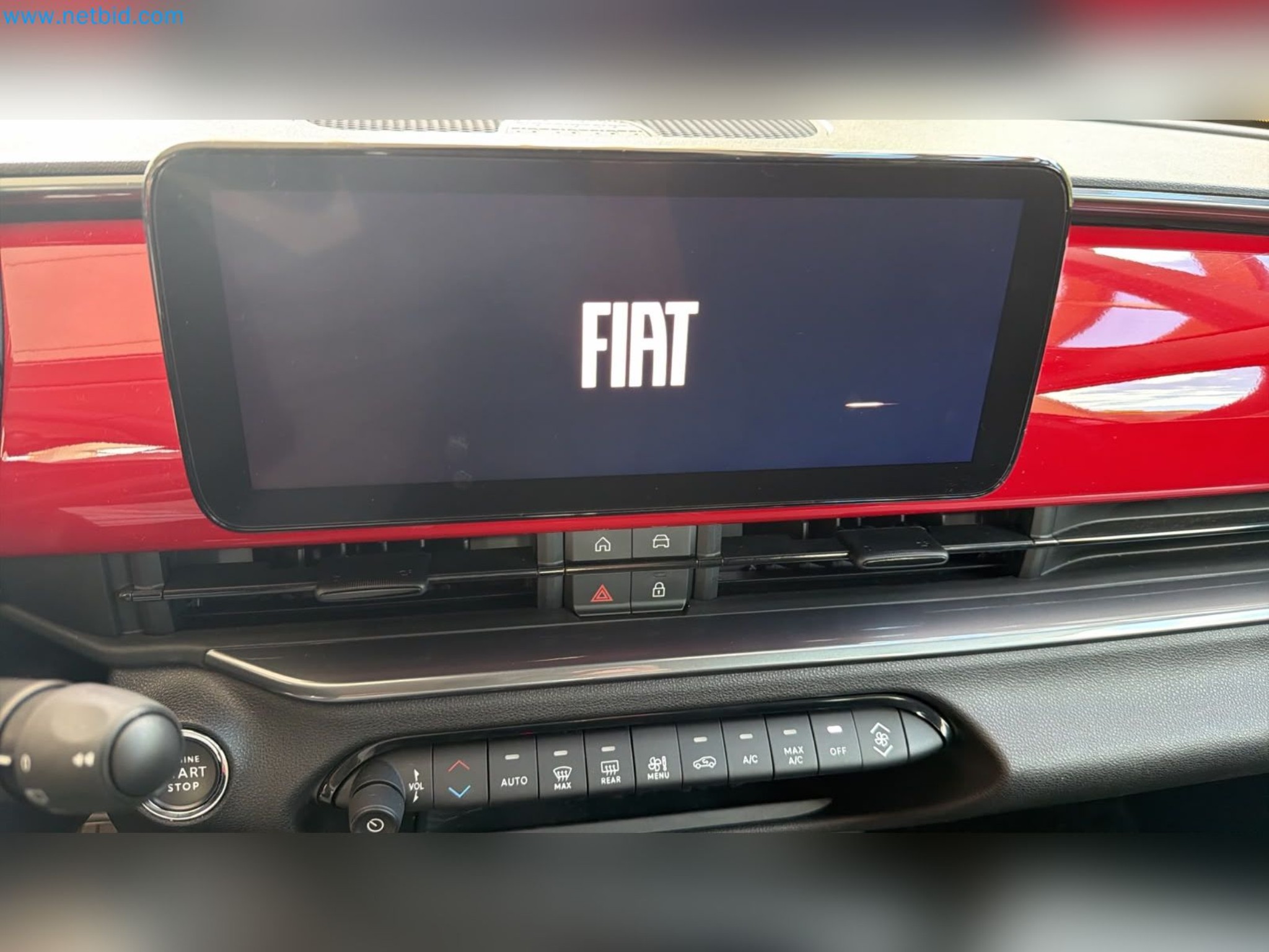 Passenger cars, electric cars, and automotive repair shop equipment at a Fiat dealership-15