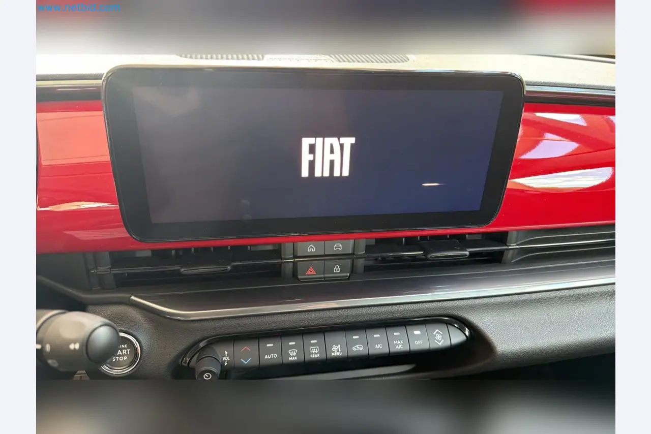 Passenger cars, electric cars, and automotive repair shop equipment at a Fiat dealership-15