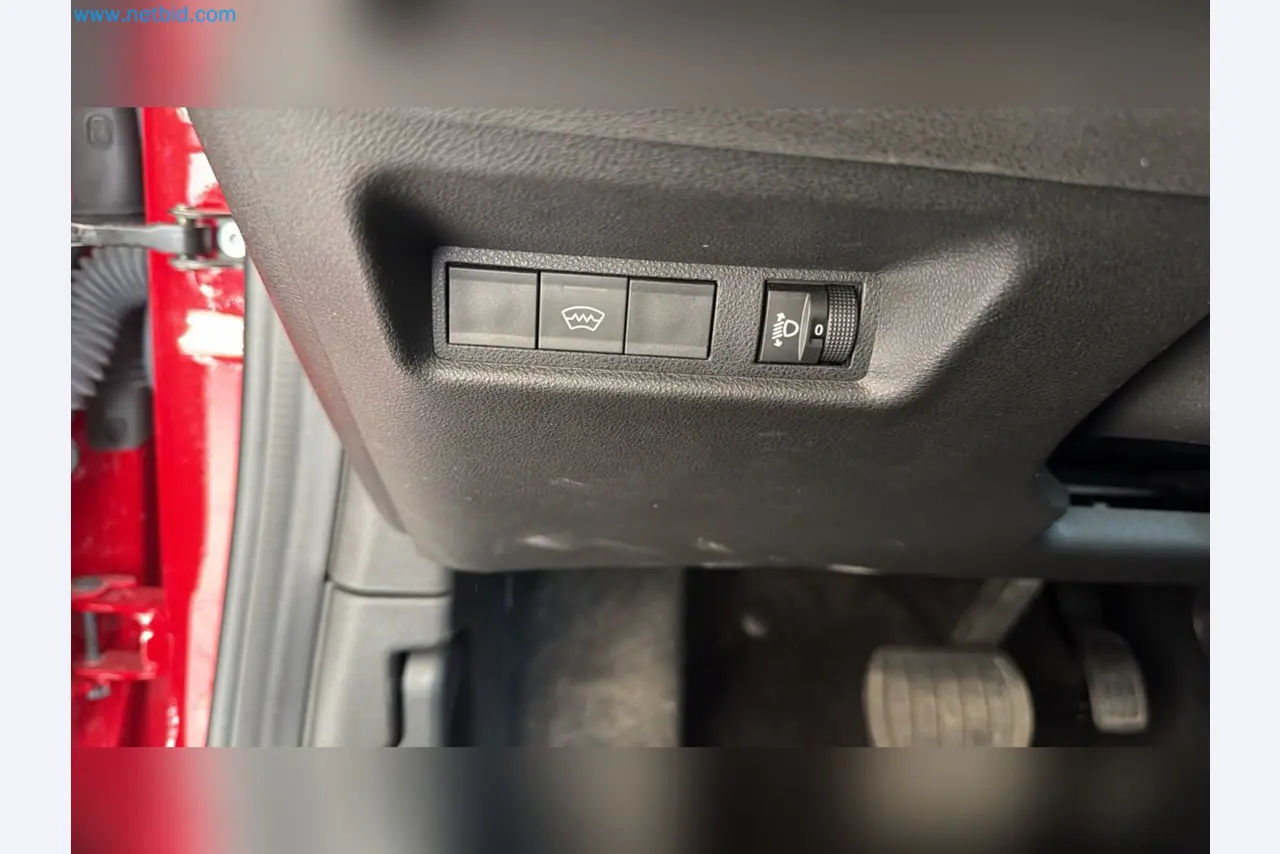 Passenger cars, electric cars, and automotive repair shop equipment at a Fiat dealership-16