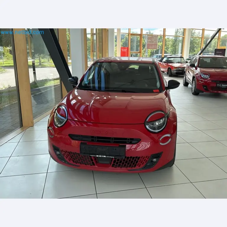 Passenger cars, electric cars, and automotive repair shop equipment at a Fiat dealership-1