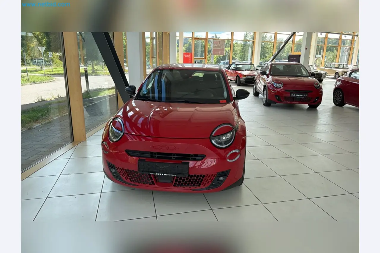 Passenger cars, electric cars, and automotive repair shop equipment at a Fiat dealership-2