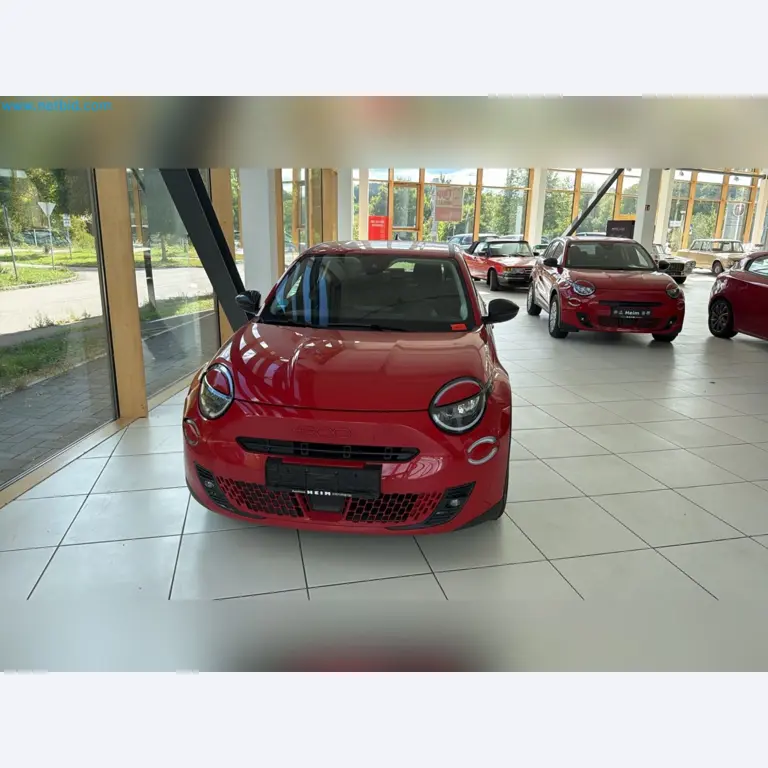 Passenger cars, electric cars, and automotive repair shop equipment at a Fiat dealership-2