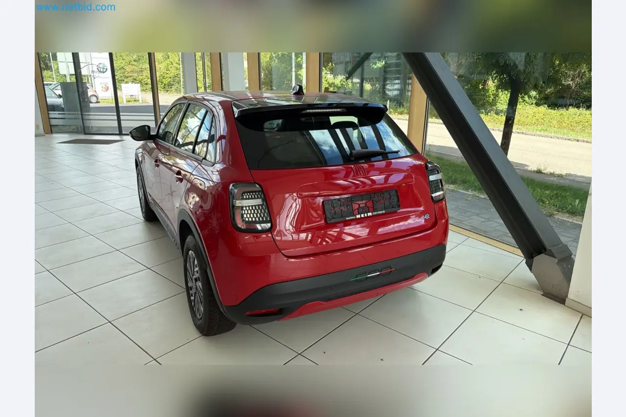 Passenger cars, electric cars, and automotive repair shop equipment at a Fiat dealership-3