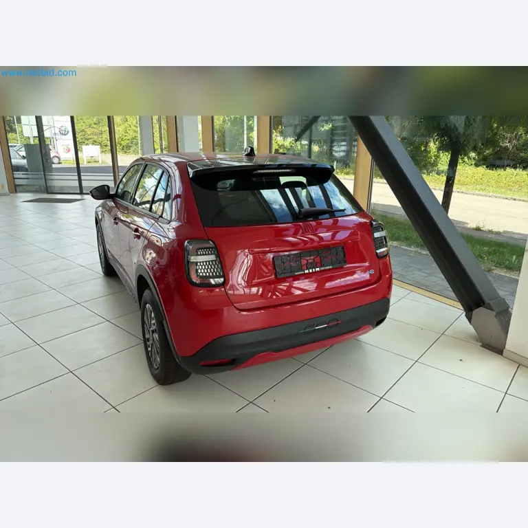 Passenger cars, electric cars, and automotive repair shop equipment at a Fiat dealership-3