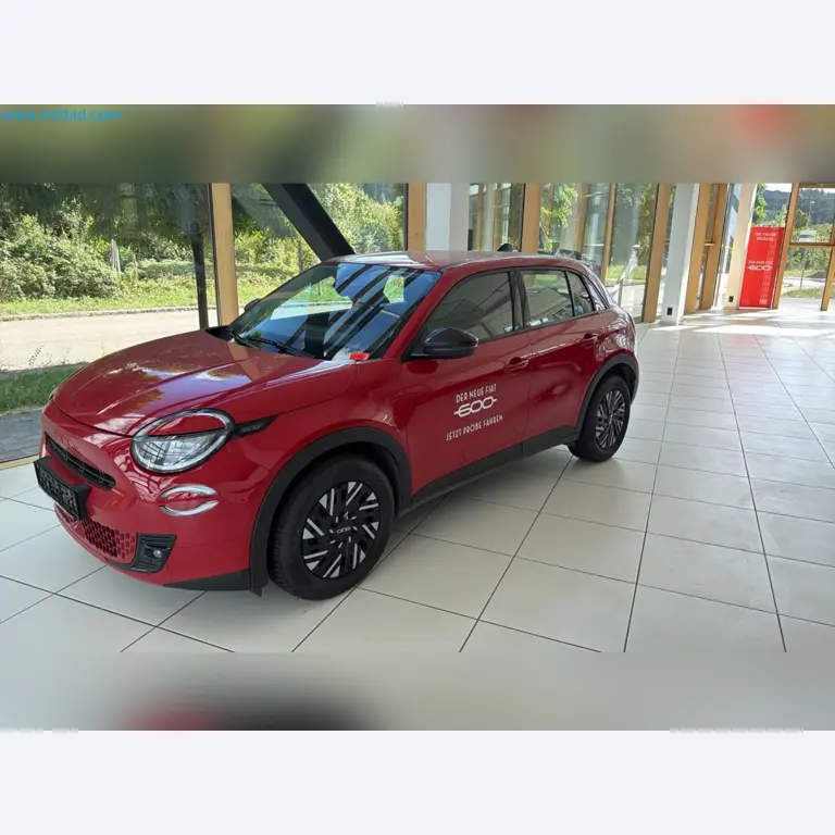 Passenger cars, electric cars, and automotive repair shop equipment at a Fiat dealership-4